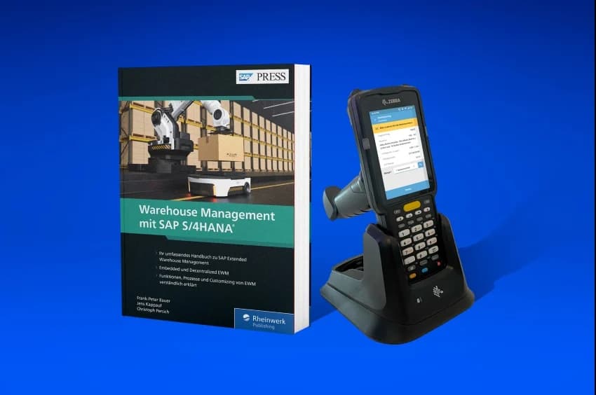 Book titled Warehouse Management with SAP S4HANA placed beside a Zebra handheld scanner in a docking station, illustrating SAP EWM mobile process tools.